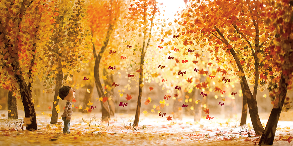 Inside spread from Magic Candies of a boy watching in wonder as the autumn leaves fall around him as they whisper the word "bye"